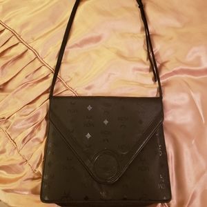Authentic Large MCM clutch with adjustable strap